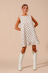 Texture Bow Printed Ruffle Mini Dress-Chic black & white bow print mini dress with a playful ruffle hem. Sleeveless & lightweight for effortless summer style, perfect for day or night outings.-Reef Love Boho-Chic Boutique