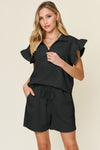 Women's Black Textured, stretchy, and comfy flounce sleeve top and drawstring shorts set. This set is perfect for a travel day, or out running around town, the set can also be dressed up with heels and accessories for versatility while on the go - Reef Love