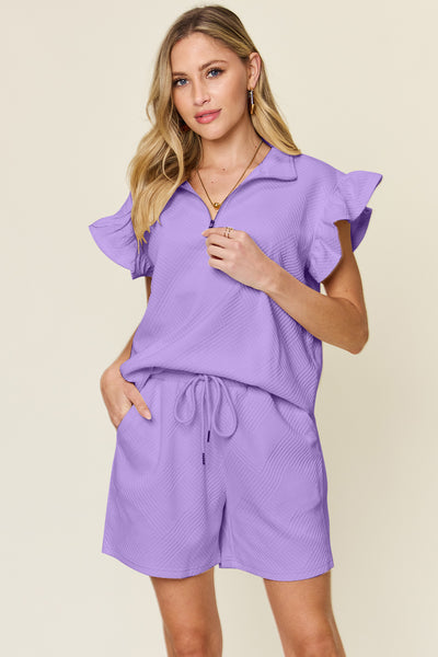 Women's purple Textured, stretchy, and comfy flounce sleeve top and drawstring shorts set. This set is perfect for a travel day, or out running around town, the set can also be dressed up with heels and accessories for versatility while on the go - Reef Love
