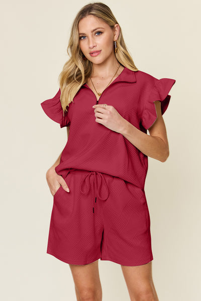 Women's Textured, stretchy, and comfy flounce sleeve top and drawstring shorts set. This set is perfect for a travel day, or out running around town, the set can also be dressed up with heels and accessories for versatility while on the go - Reef Love