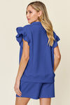 Women's Blue Textured, stretchy, and comfy flounce sleeve top and drawstring shorts set. This set is perfect for a travel day, or out running around town, the set can also be dressed up with heels and accessories for versatility while on the go - Reef Love