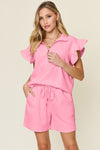 Women's pink Textured, stretchy, and comfy flounce sleeve top and drawstring shorts set. This set is perfect for a travel day, or out running around town, the set can also be dressed up with heels and accessories for versatility while on the go - Reef Love