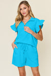Women's Textured, stretchy, and comfy flounce sleeve top and drawstring shorts set. This set is perfect for a travel day, or out running around town, the set can also be dressed up with heels and accessories for versatility while on the go - Reef Love