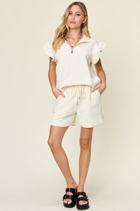 Women's Textured, stretchy, and comfy flounce sleeve top and drawstring shorts set. This set is perfect for a travel day, or out running around town, the set can also be dressed up with heels and accessories for versatility while on the go - Reef Love