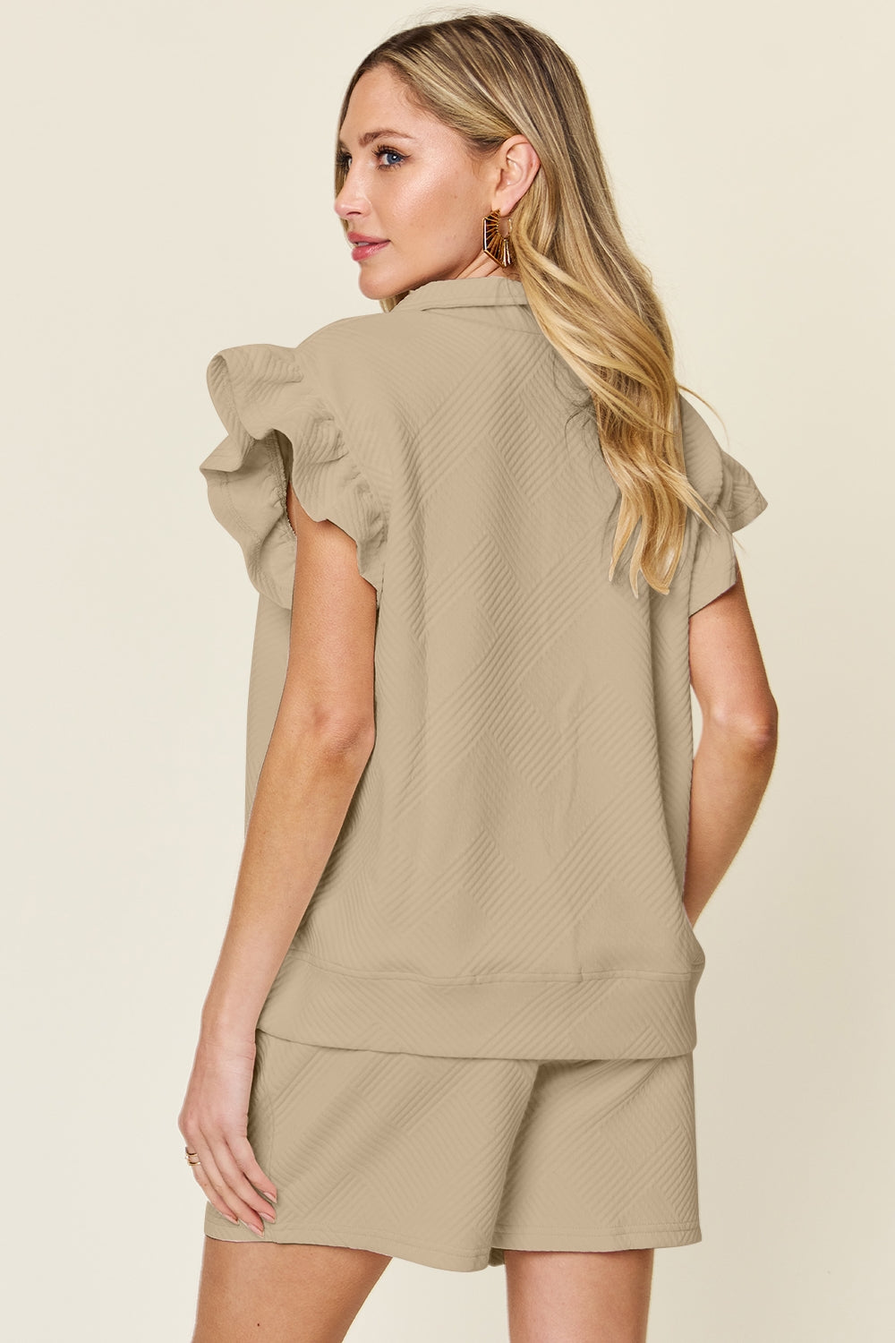 Women's Textured, stretchy, and comfy flounce sleeve top and drawstring shorts set. This set is perfect for a travel day, or out running around town, the set can also be dressed up with heels and accessories for versatility while on the go - Reef Love