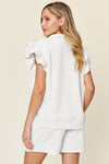 Women's Textured, stretchy, and comfy flounce sleeve top and drawstring shorts set. This set is perfect for a travel day, or out running around town, the set can also be dressed up with heels and accessories for versatility while on the go - Reef Love
