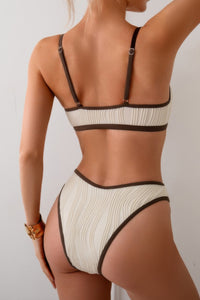 Shop Two Pieces Pleated Cut Out High Cut Bikini-High-cut two-piece bikini with pleated texture and bold cut-outs. Flattering and modern—perfect for beach vacations, pool parties, or resort wear.-available at Reef Love online boho-chic boutique