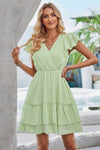 Woman wearing Ruffle Trim V Neck Fit Dress-Effortlessly stylish and flattering, this dress features ruffle trim and a deep V-neckline for a touch of romance. Fitted silhouette enhances your natural shape