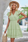 Woman wearing Ruffle Trim V Neck Fit Dress-Effortlessly stylish and flattering, this dress features ruffle trim and a deep V-neckline for a touch of romance. Fitted silhouette enhances your natural shape
