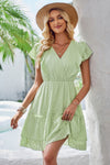 Woman wearing Ruffle Trim V Neck Fit Dress-Effortlessly stylish and flattering, this dress features ruffle trim and a deep V-neckline for a touch of romance. Fitted silhouette enhances your natural shape
