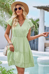 Woman wearing Ruffle Trim V Neck Fit Dress-Effortlessly stylish and flattering, this dress features ruffle trim and a deep V-neckline for a touch of romance. Fitted silhouette enhances your natural shape