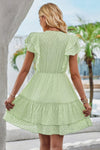 Woman wearing Ruffle Trim V Neck Fit Dress-Effortlessly stylish and flattering, this dress features ruffle trim and a deep V-neckline for a touch of romance. Fitted silhouette enhances your natural shape