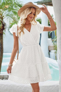 Woman wearing Ruffle Trim V Neck Fit Dress-Effortlessly stylish and flattering, this dress features ruffle trim and a deep V-neckline for a touch of romance. Fitted silhouette enhances your natural shape