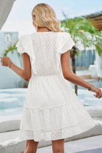 Woman wearing Ruffle Trim V Neck Fit Dress-Effortlessly stylish and flattering, this dress features ruffle trim and a deep V-neckline for a touch of romance. Fitted silhouette enhances your natural shape