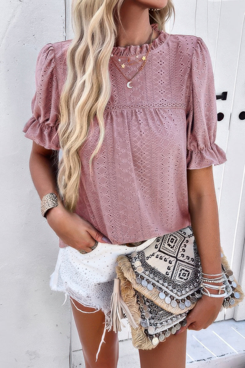 Woman wearing Embroidery Ruffle Sleeve Loose Fit Blouse-Add a touch of charm to your everyday look with this round neck embroidered shirt, featuring ruffle sleeves and a relaxed silhouette and intricate embroidery.