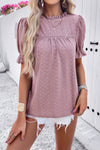 Woman wearing Embroidery Ruffle Sleeve Loose Fit Blouse-Add a touch of charm to your everyday look with this round neck embroidered shirt, featuring ruffle sleeves and a relaxed silhouette and intricate embroidery.