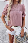 Woman wearing Embroidery Ruffle Sleeve Loose Fit Blouse-Add a touch of charm to your everyday look with this round neck embroidered shirt, featuring ruffle sleeves and a relaxed silhouette and intricate embroidery.