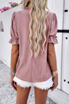 Woman wearing Embroidery Ruffle Sleeve Loose Fit Blouse-Add a touch of charm to your everyday look with this round neck embroidered shirt, featuring ruffle sleeves and a relaxed silhouette and intricate embroidery.