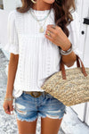 Woman wearing Embroidery Ruffle Sleeve Loose Fit Blouse-Add a touch of charm to your everyday look with this round neck embroidered shirt, featuring ruffle sleeves and a relaxed silhouette and intricate embroidery.