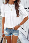 Woman wearing Embroidery Ruffle Sleeve Loose Fit Blouse-Add a touch of charm to your everyday look with this round neck embroidered shirt, featuring ruffle sleeves and a relaxed silhouette and intricate embroidery.
