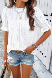 Woman wearing Embroidery Ruffle Sleeve Loose Fit Blouse-Add a touch of charm to your everyday look with this round neck embroidered shirt, featuring ruffle sleeves and a relaxed silhouette and intricate embroidery.