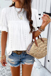 Woman wearing Embroidery Ruffle Sleeve Loose Fit Blouse-Add a touch of charm to your everyday look with this round neck embroidered shirt, featuring ruffle sleeves and a relaxed silhouette and intricate embroidery.