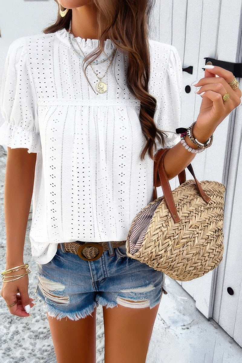 Woman wearing Embroidery Ruffle Sleeve Loose Fit Blouse-Add a touch of charm to your everyday look with this round neck embroidered shirt, featuring ruffle sleeves and a relaxed silhouette and intricate embroidery.