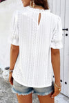 Woman wearing Embroidery Ruffle Sleeve Loose Fit Blouse-Add a touch of charm to your everyday look with this round neck embroidered shirt, featuring ruffle sleeves and a relaxed silhouette and intricate embroidery.