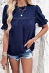 Woman wearing Embroidery Ruffle Sleeve Loose Fit Blouse-Add a touch of charm to your everyday look with this round neck embroidered shirt, featuring ruffle sleeves and a relaxed silhouette and intricate embroidery.