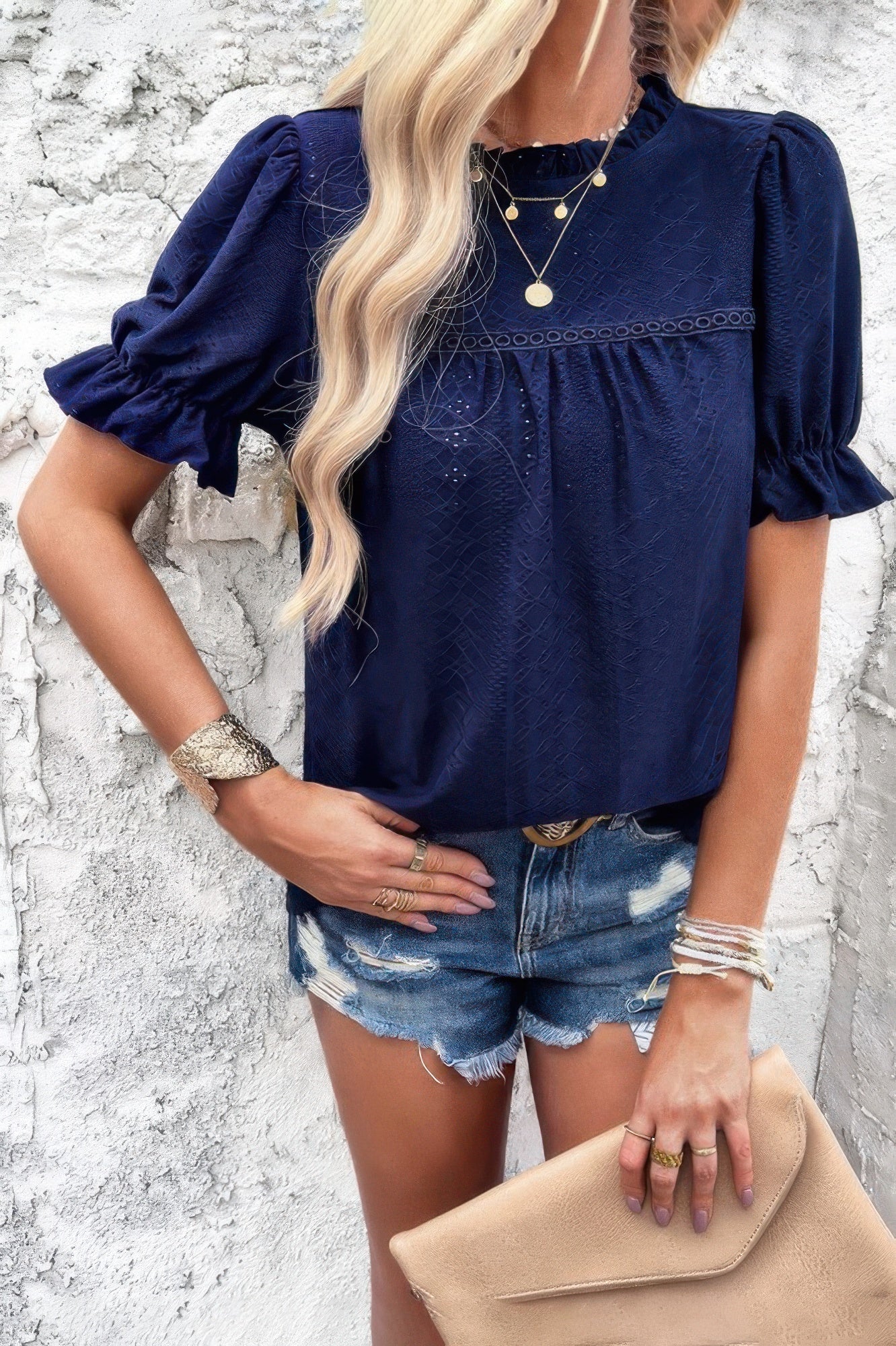 Woman wearing Embroidery Ruffle Sleeve Loose Fit Blouse-Add a touch of charm to your everyday look with this round neck embroidered shirt, featuring ruffle sleeves and a relaxed silhouette and intricate embroidery.