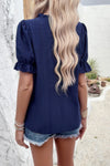 Woman wearing Embroidery Ruffle Sleeve Loose Fit Blouse-Add a touch of charm to your everyday look with this round neck embroidered shirt, featuring ruffle sleeves and a relaxed silhouette and intricate embroidery.