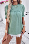 Woman wearing Embroidery Ruffle Sleeve Loose Fit Blouse-Add a touch of charm to your everyday look with this round neck embroidered shirt, featuring ruffle sleeves and a relaxed silhouette and intricate embroidery.