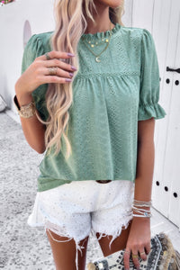 Woman wearing Embroidery Ruffle Sleeve Loose Fit Blouse-Add a touch of charm to your everyday look with this round neck embroidered shirt, featuring ruffle sleeves and a relaxed silhouette and intricate embroidery.