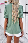 Woman wearing Embroidery Ruffle Sleeve Loose Fit Blouse-Add a touch of charm to your everyday look with this round neck embroidered shirt, featuring ruffle sleeves and a relaxed silhouette and intricate embroidery.