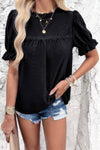 Woman wearing Embroidery Ruffle Sleeve Loose Fit Blouse-Add a touch of charm to your everyday look with this round neck embroidered shirt, featuring ruffle sleeves and a relaxed silhouette and intricate embroidery.