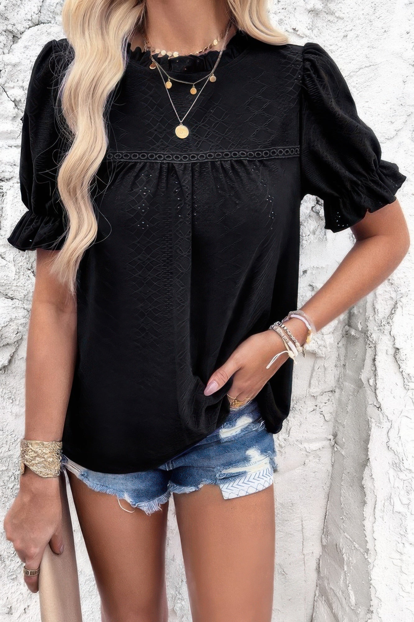 Woman wearing Embroidery Ruffle Sleeve Loose Fit Blouse-Add a touch of charm to your everyday look with this round neck embroidered shirt, featuring ruffle sleeves and a relaxed silhouette and intricate embroidery.