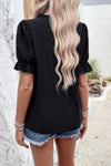 Woman wearing Embroidery Ruffle Sleeve Loose Fit Blouse-Add a touch of charm to your everyday look with this round neck embroidered shirt, featuring ruffle sleeves and a relaxed silhouette and intricate embroidery.