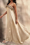 Woman wearing Flower Trim Spaghetti Strap Maxi Dress-Embrace a romantic and breezy vibe with this flower trim sleeveless dress, designed to turn heads with its ruffled, maxi silhouette. Breathable comfort.