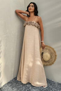 Woman wearing Flower Trim Spaghetti Strap Maxi Dress-Embrace a romantic and breezy vibe with this flower trim sleeveless dress, designed to turn heads with its ruffled, maxi silhouette. Breathable comfort.