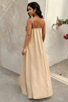 Woman wearing Flower Trim Spaghetti Strap Maxi Dress-Embrace a romantic and breezy vibe with this flower trim sleeveless dress, designed to turn heads with its ruffled, maxi silhouette. Breathable comfort.