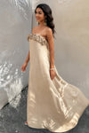 Woman wearing Flower Trim Spaghetti Strap Maxi Dress-Embrace a romantic and breezy vibe with this flower trim sleeveless dress, designed to turn heads with its ruffled, maxi silhouette. Breathable comfort.