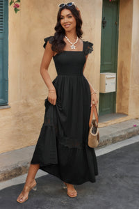 Woman wearing Lace Patchwork Textured Maxi Dress-Elegant and effortlessly wearable, this solid sleeveless dress features delicate lace patchwork and a subtle textured finish for added dimension. 