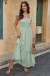 Woman wearing Lace Patchwork Textured Maxi Dress-Elegant and effortlessly wearable, this solid sleeveless dress features delicate lace patchwork and a subtle textured finish for added dimension. 