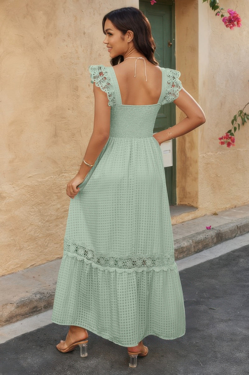 Woman wearing Lace Patchwork Textured Maxi Dress-Elegant and effortlessly wearable, this solid sleeveless dress features delicate lace patchwork and a subtle textured finish for added dimension. 