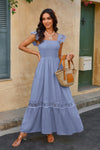 Woman wearing Lace Patchwork Textured Maxi Dress-Elegant and effortlessly wearable, this solid sleeveless dress features delicate lace patchwork and a subtle textured finish for added dimension. 