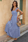 Woman wearing Lace Patchwork Textured Maxi Dress-Elegant and effortlessly wearable, this solid sleeveless dress features delicate lace patchwork and a subtle textured finish for added dimension. 