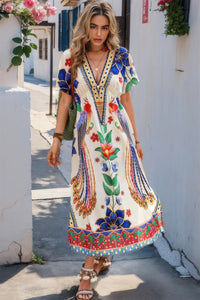 Woman wearing Floral Deep V Neck Batwing Sleeve Maxi Dress-Step into boho effortless elegance with this floral deep V-neck batwing sleeve dress, designed to flatter and flow with every movement. 