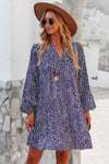 Woman wearing Polka Dot Tunic Dress-Bring playful charm to your wardrobe with this Polka Dot Tunic Dress. Designed for comfort and effortless style. Crafted from breathable, lightweight fabric.