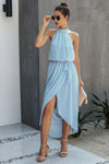 Woman wearing Halter Neck Empire Waist Spilt Dress-Turn heads with this Halter Empire Waist Split Dress. Designed with a flattering halter neckline, elegant empire waist, and a stylish front split for added drama.