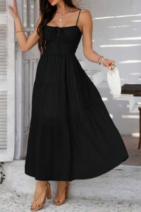 Woman wearing Sleeveless Smocked Tiered Maxi Dress-Breeze through sunny days in this Solid Sleeveless Smocked Tiered Maxi Cami Dress. Offering a flowy, feminine silhouette with effortless comfort. 